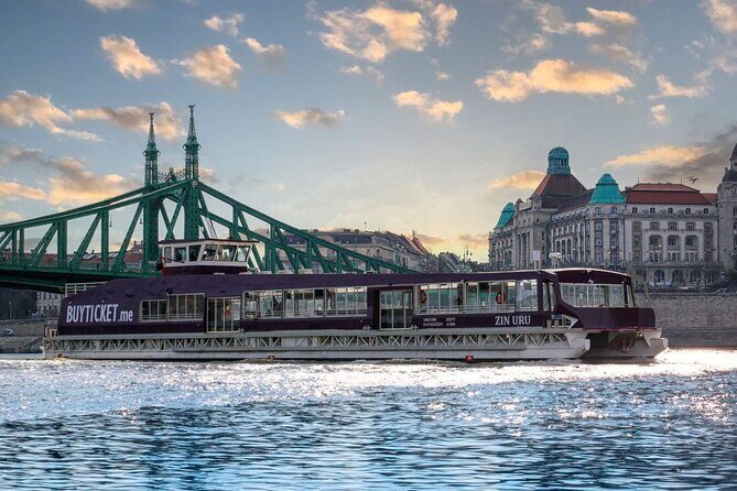 Budapest Danube 1 Hour Sunset or Night Cruise with Audio Guide - Castle District glow: hills and the night skyline feel